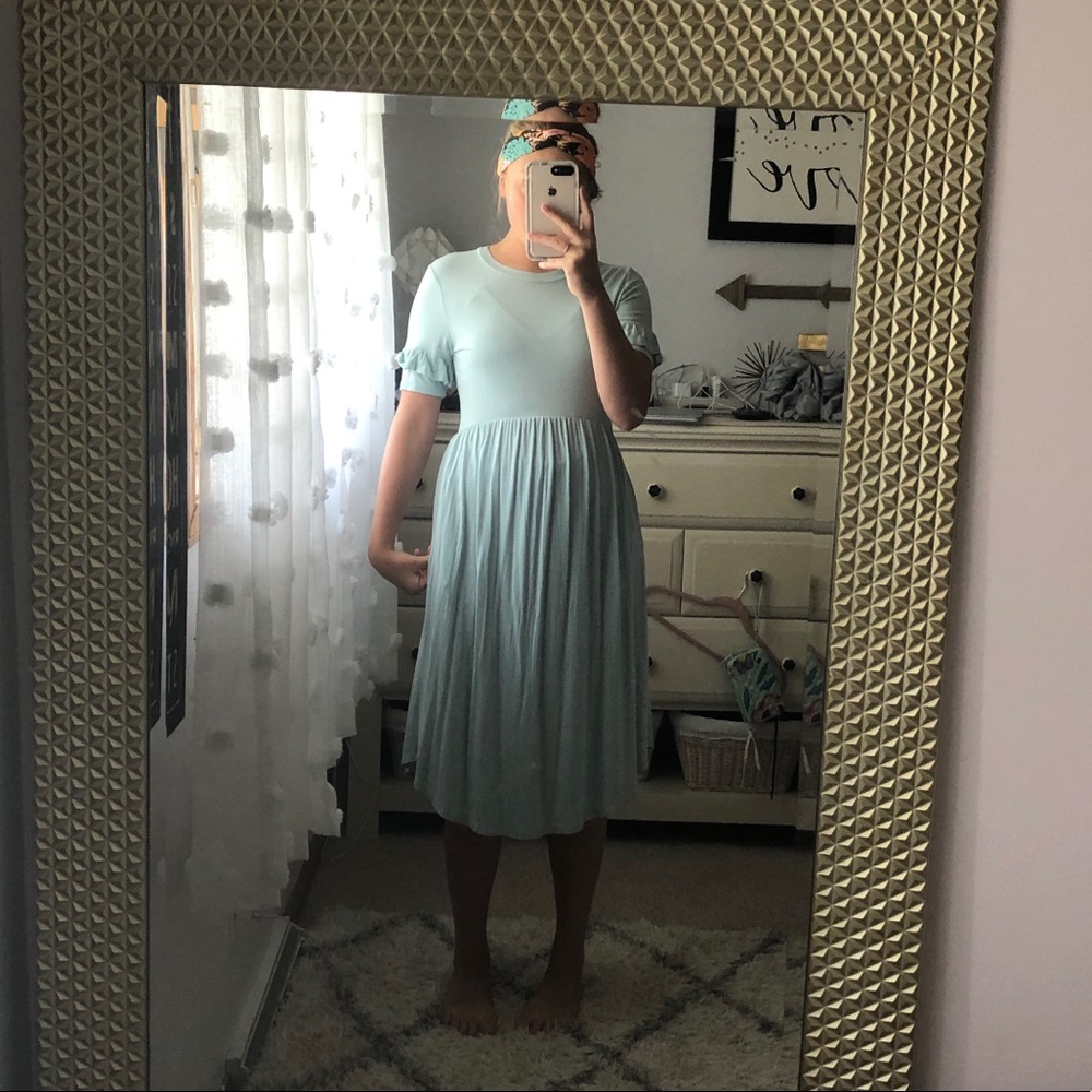 A really cute dress with ruffles one tree side:)